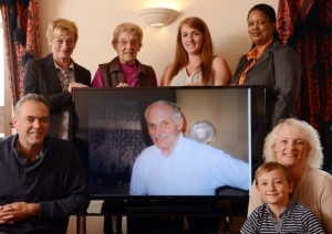 My family, staff, doctors of Sandford house and myself around the donated television. 
